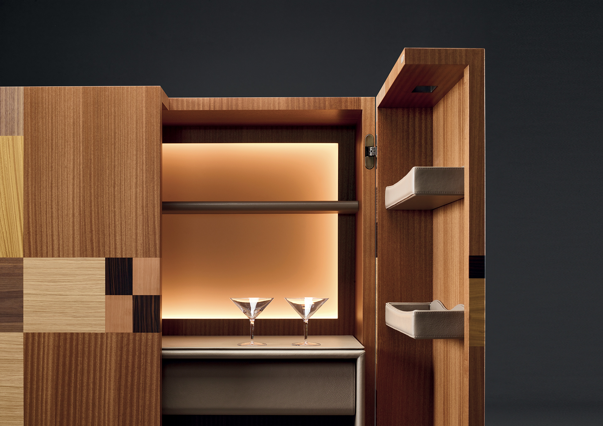 Bacco, a wooden cabinet-bar with patchwork inlay and several accessories inside and bronze base, profiles and handles, from Promemoria's catalogue | Promemoria