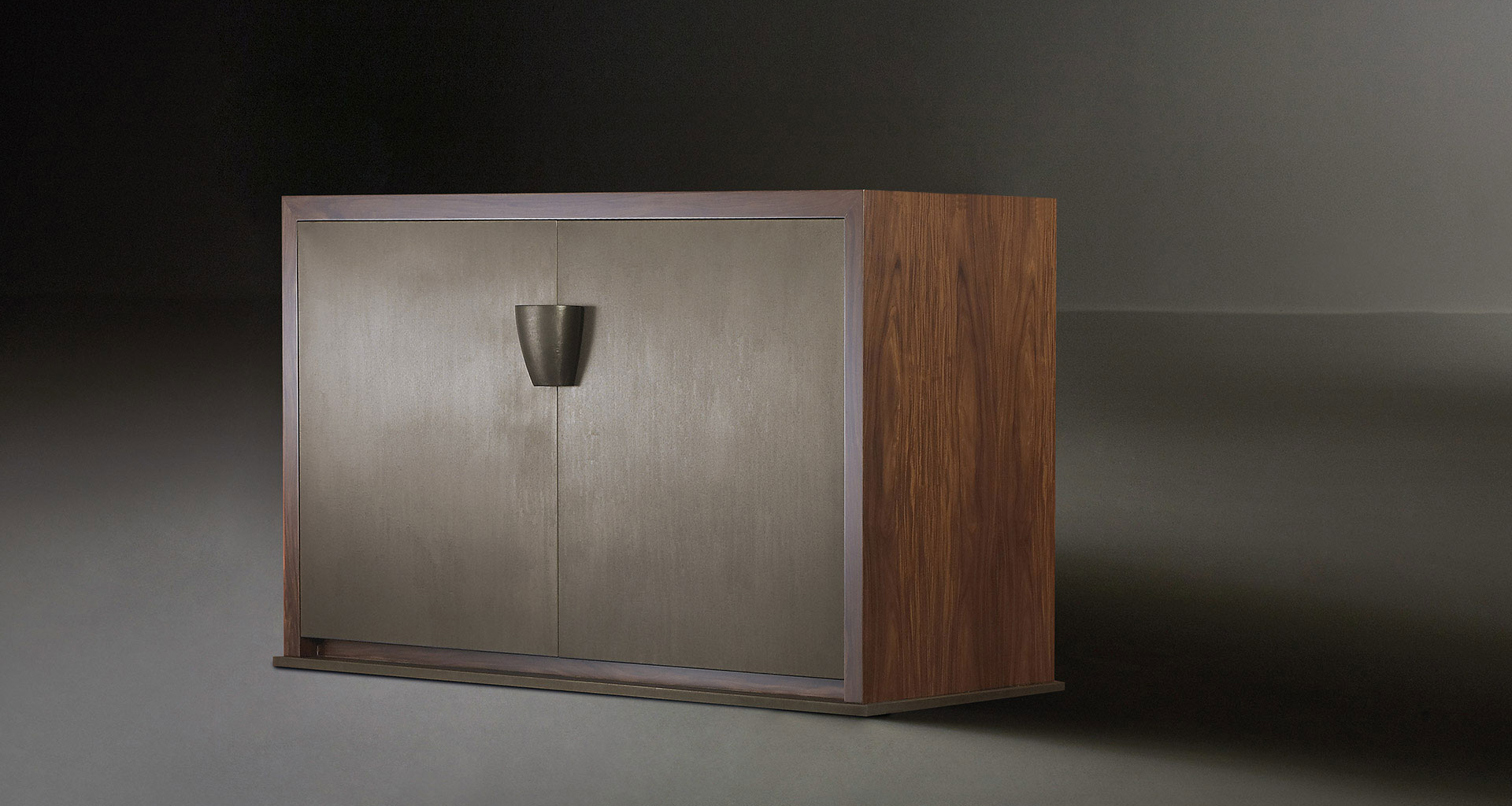 Bonaventura is a wooden cabinet with bronze base and handle, from Promemoria's catalogue | Promemoria