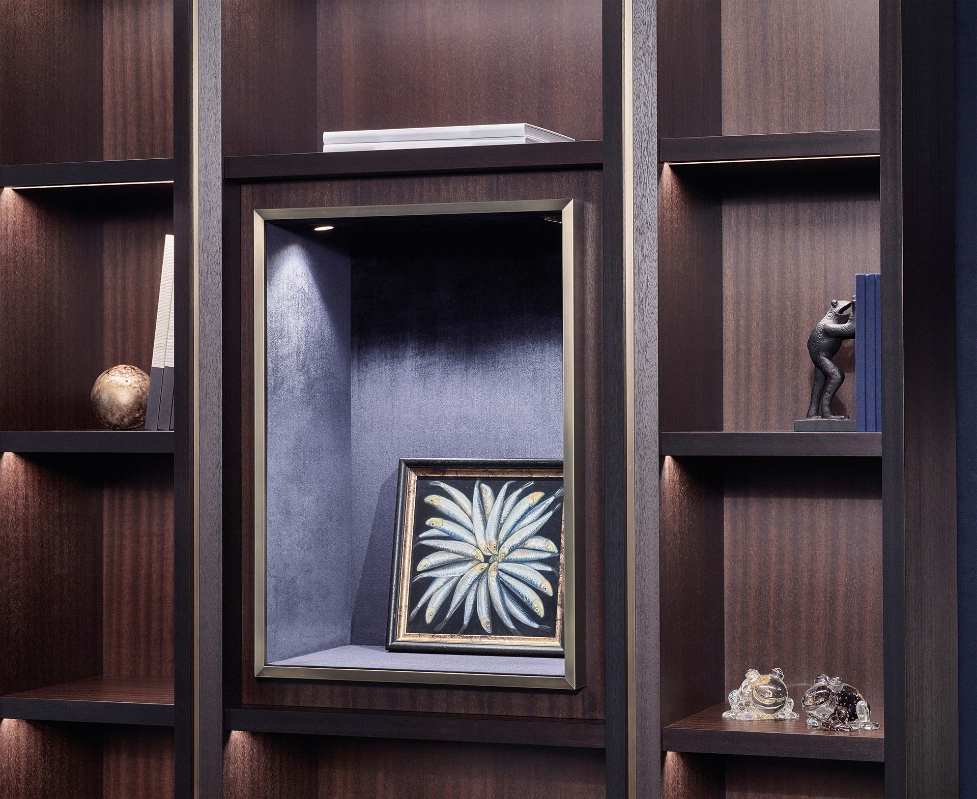 Detail of Nightwood, a wooden modular bookcase with bronze details, from Promemoria's Night Tales collection | Promemoria