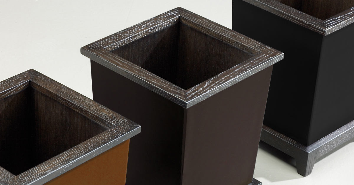 Santos are a wooden umbrella stand, flowerpot, wastepaper bin and tray, covered in leather, from Promemoria's catalogue | Promemoria