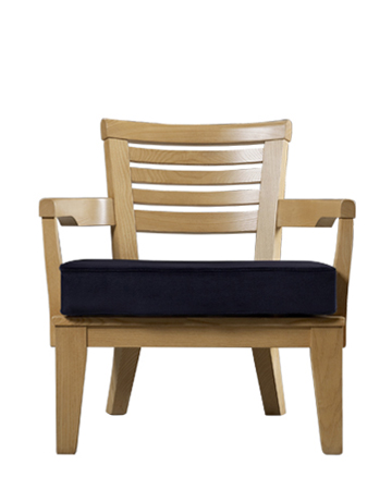 Varenna is an outdoor wooden armchair with a fabric cushion from Promemoria's outdoor catalogue | Promemoria