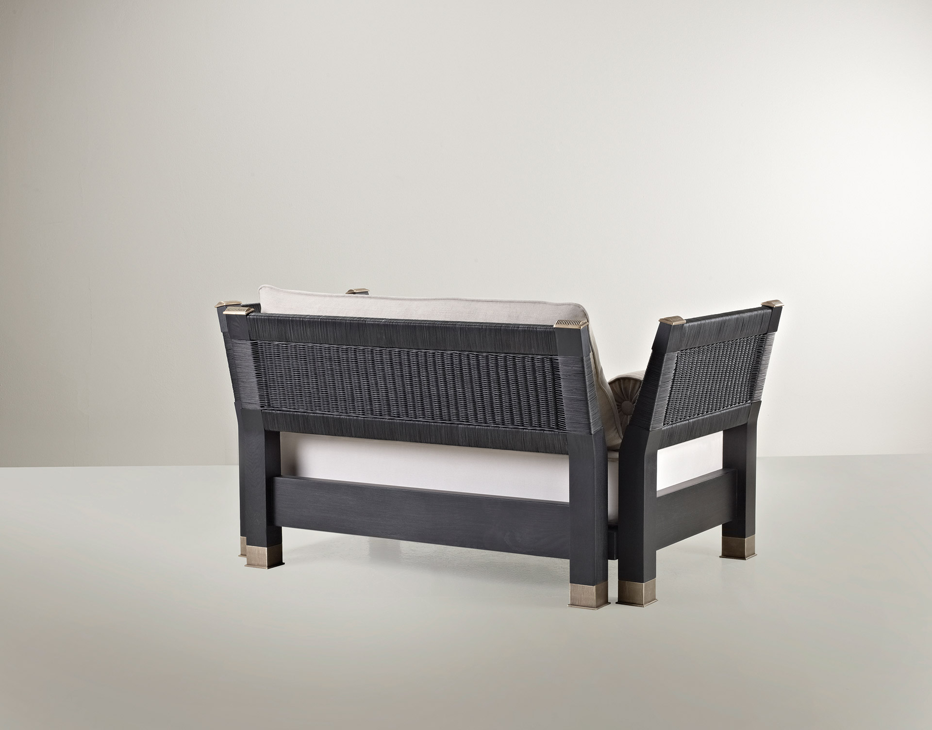 Moltrasio is an outdoor wooden sofa with bronze feet and details, from Promemoria's outdoor catalogue | Promemoria