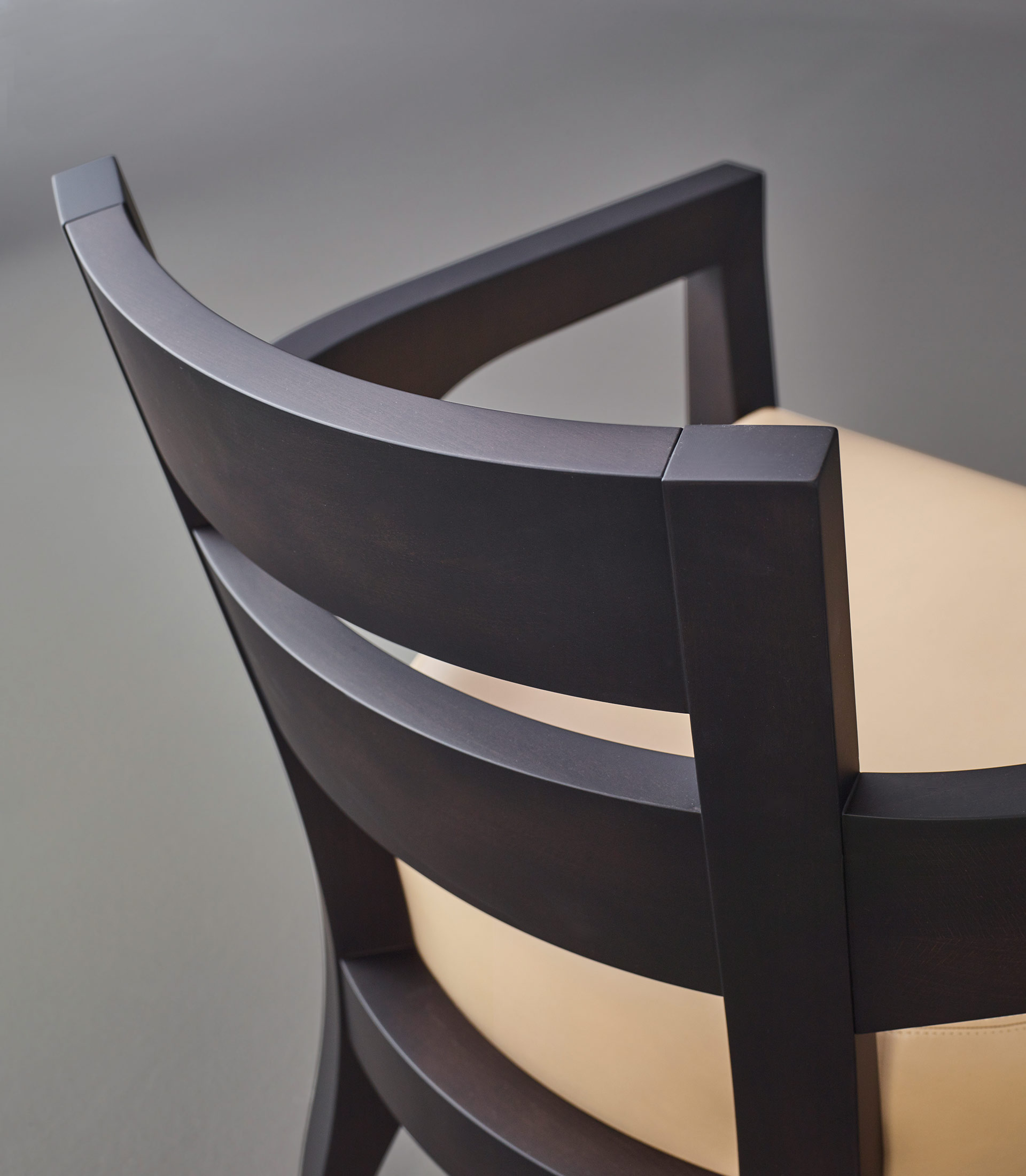 Backrest detail of Africa, a wooden armchair covered in fabric or leather, from Promemoria's catalogue | Promemoria