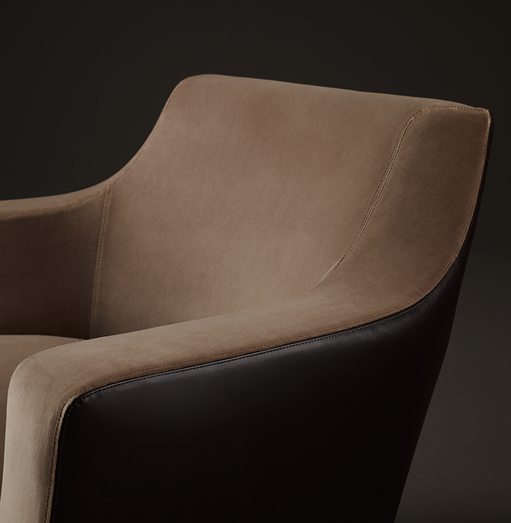 Detail of Aziza, a wooden armchair covered in fabric or leather, from Promemoria's catalogue | Promemoria