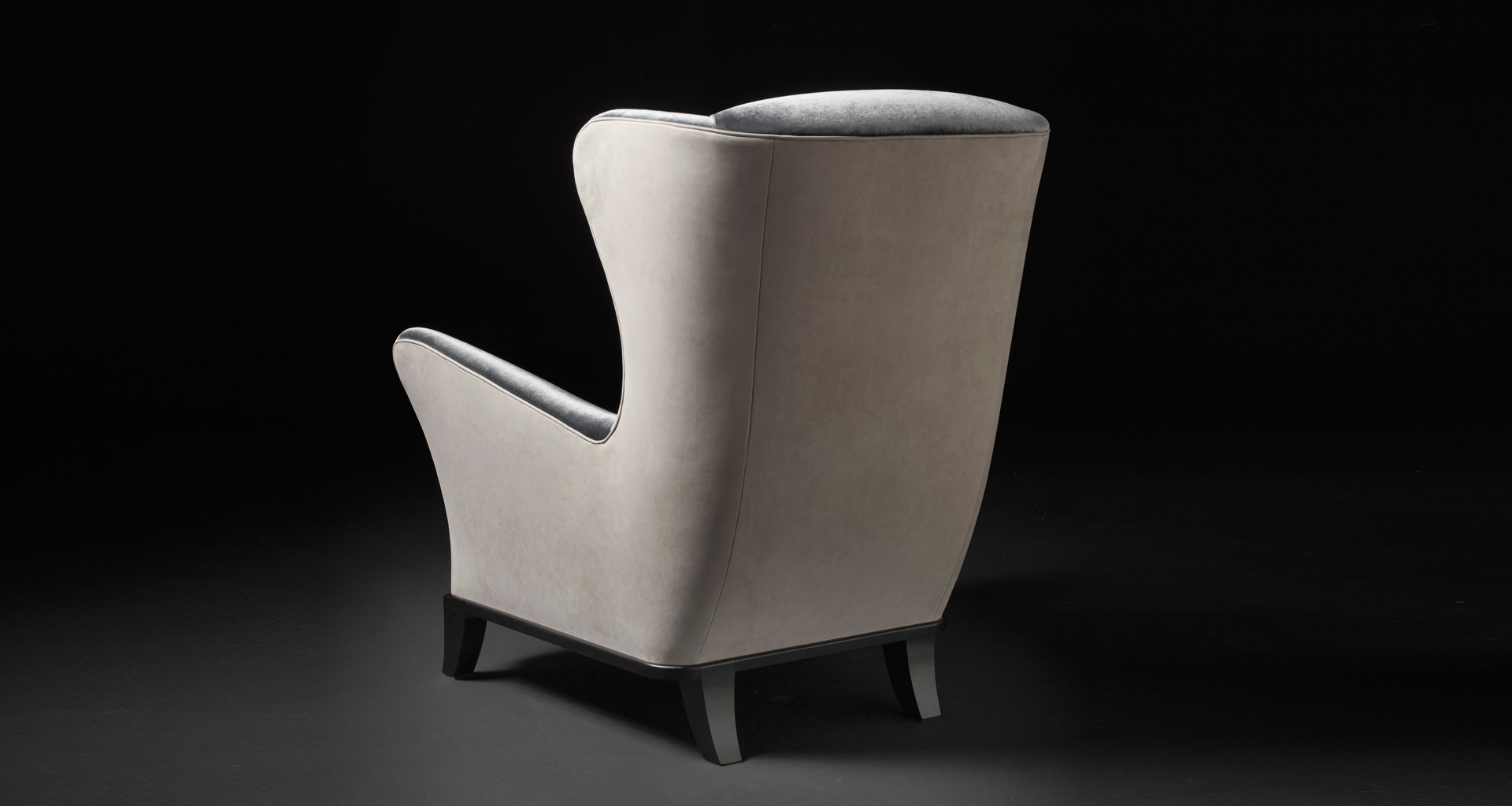 Bluette is a wooden armchair covered in fabric or leather, from Promemoria's Night Tales collection | Promemoria