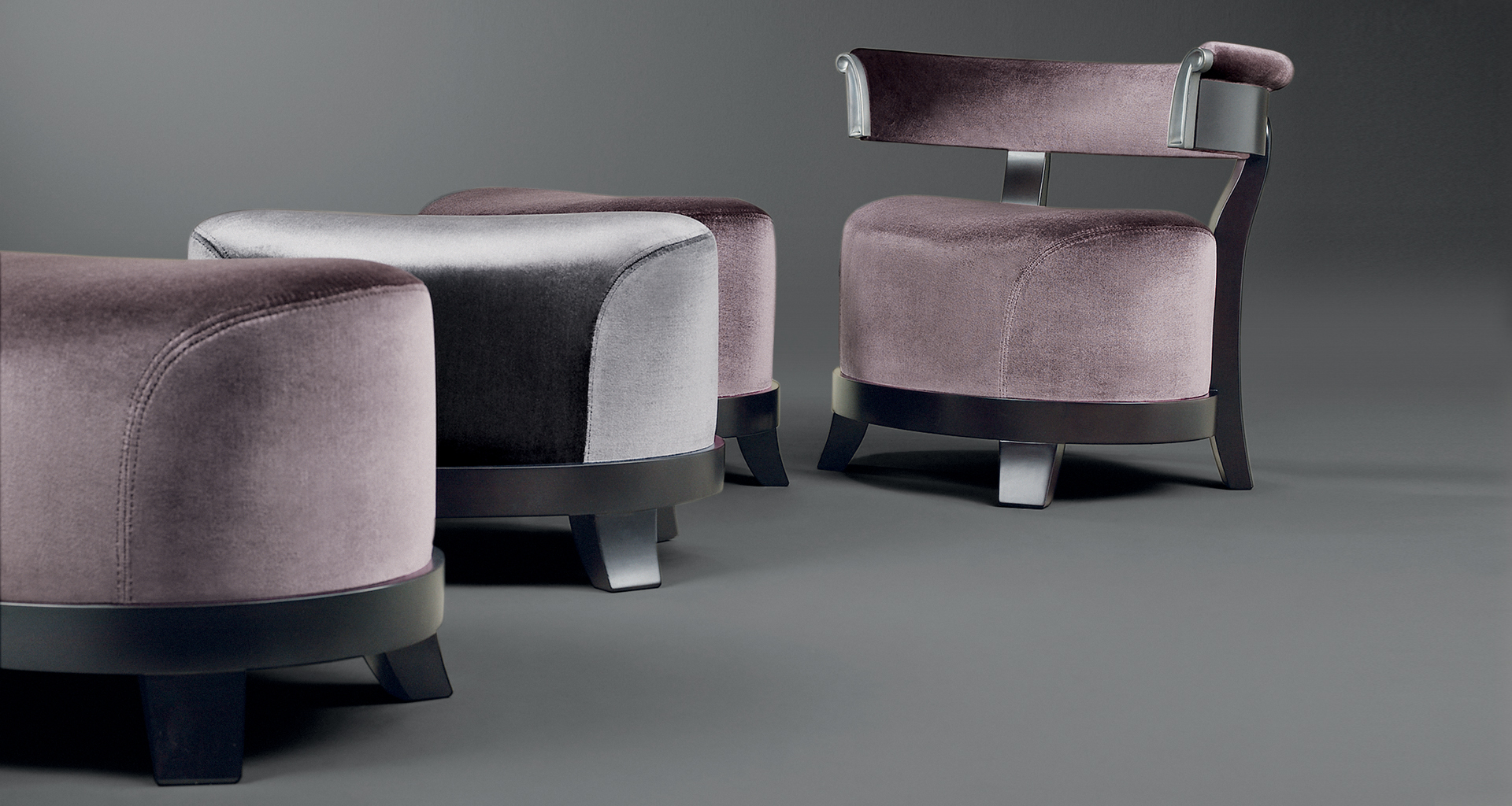 Chelsea is a wooden armchair covered in fabric or leather with bronze details, from Promemoria's catalogue | Promemoria