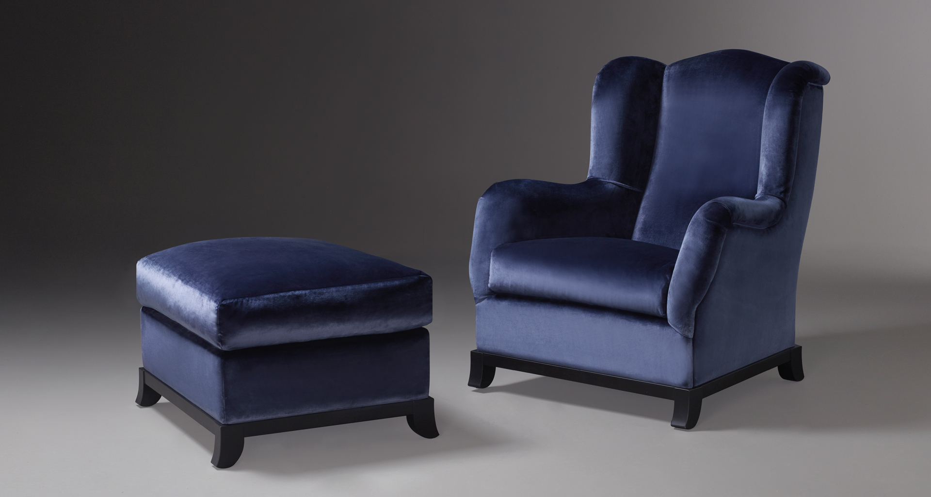 Madame A is an armchair covered in fabric or leather with wooden base, from Promemoria's catalogue | Promemoria