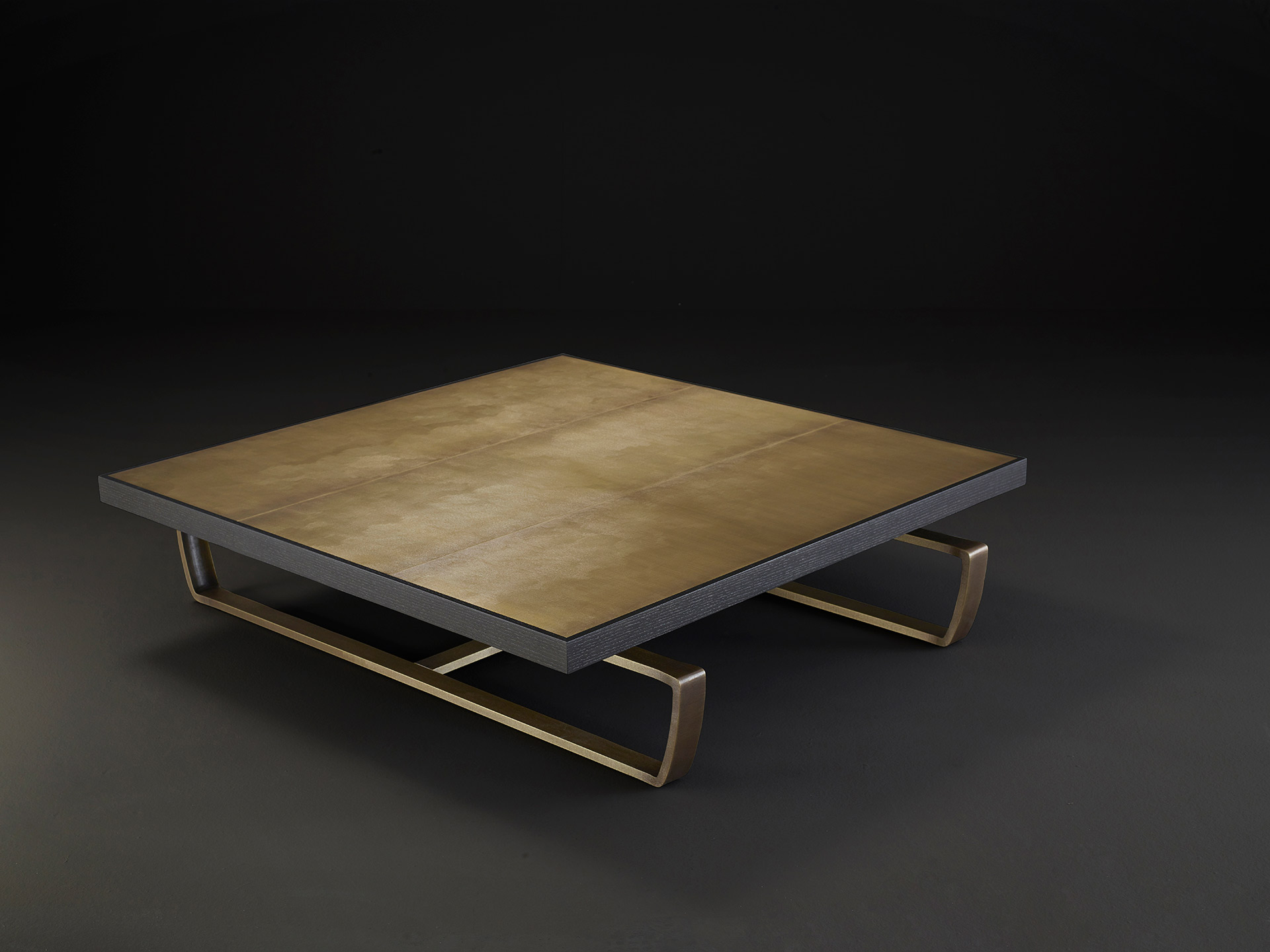 Saint Moritz is a coffee table with wooden top and bronze base, from Promemoria's catalogue | Promemoria